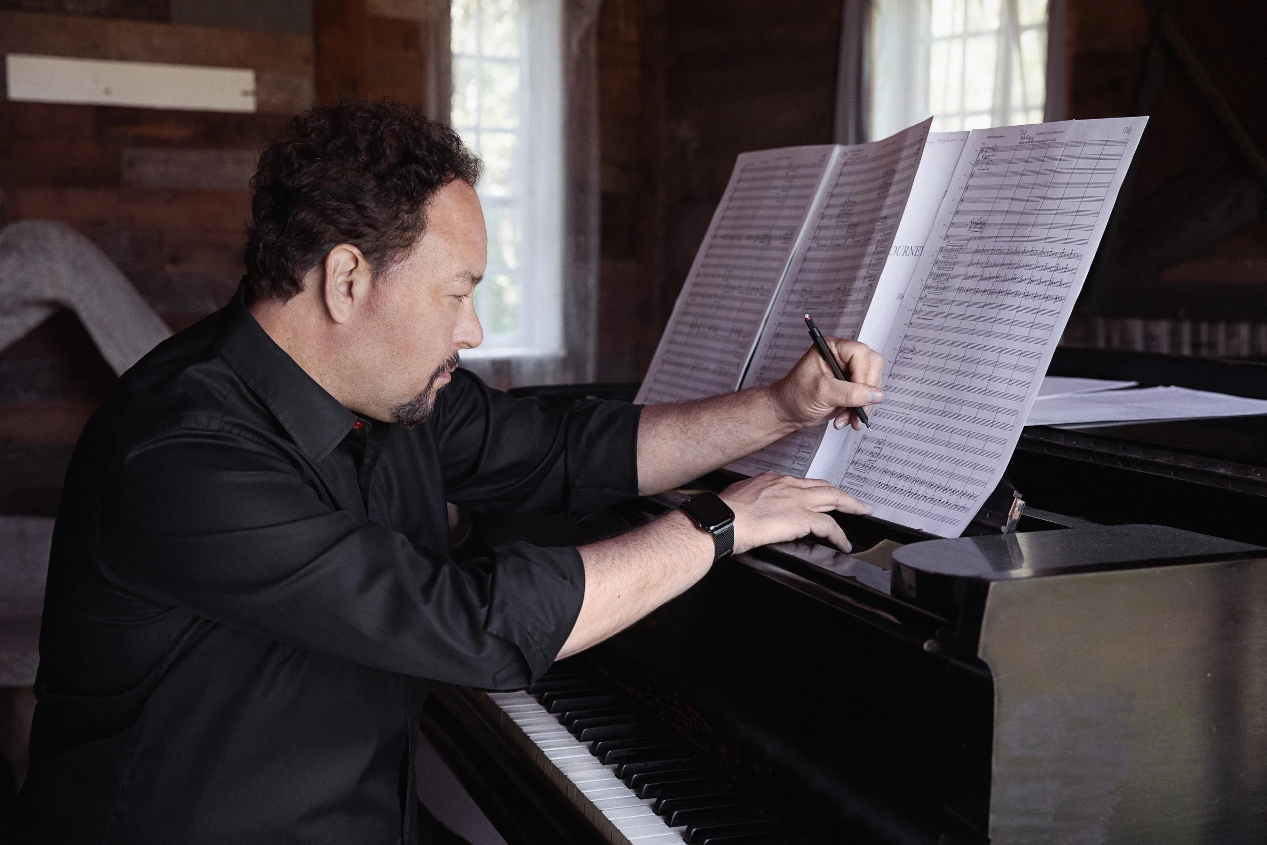 Robert Paterson composing at a piano. Credit: Lisa Marie Mazzucco